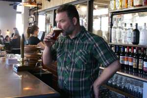 Finnie enjoys a beer.